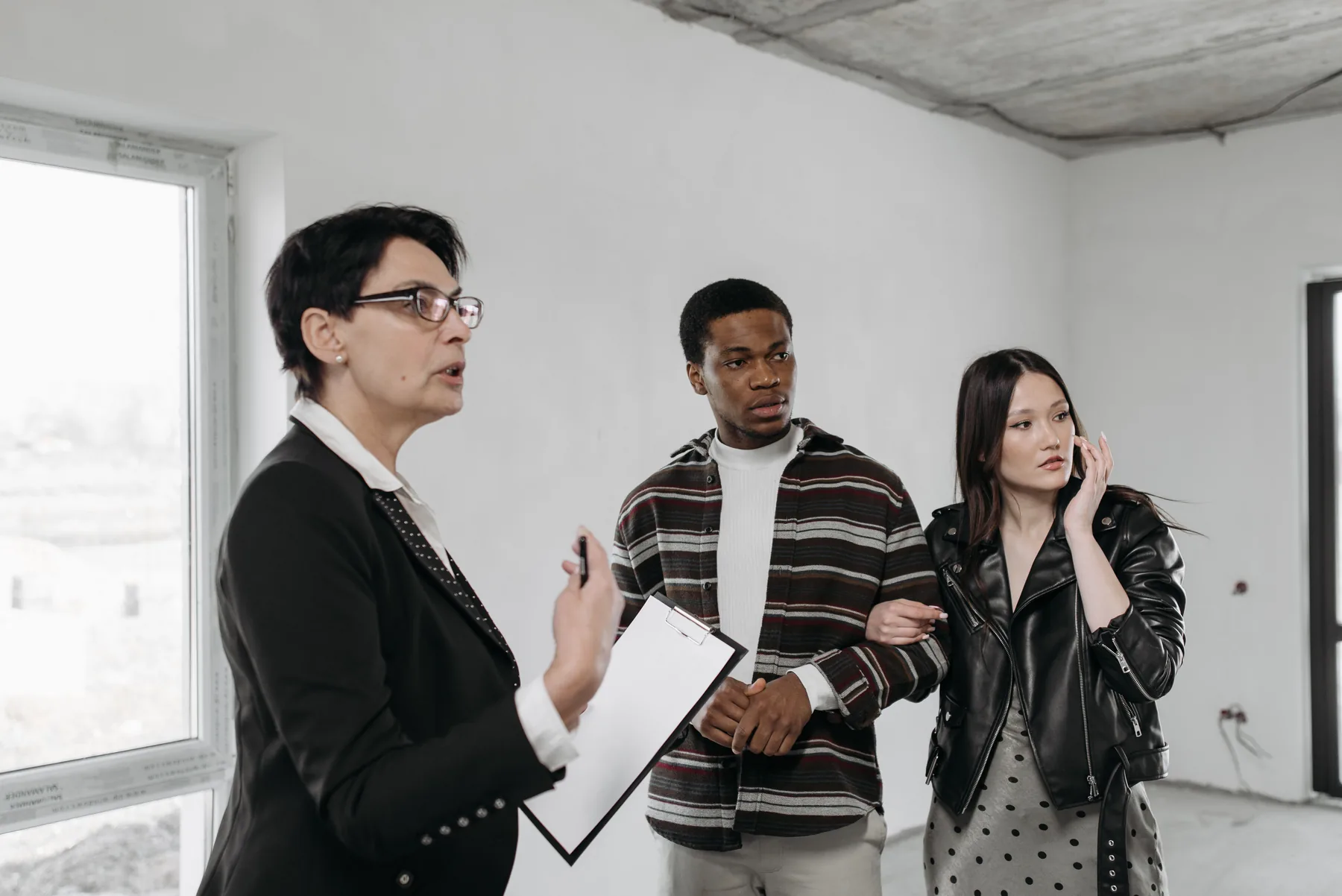 Representative couple viewing a home and discussing a possible rental arrangement