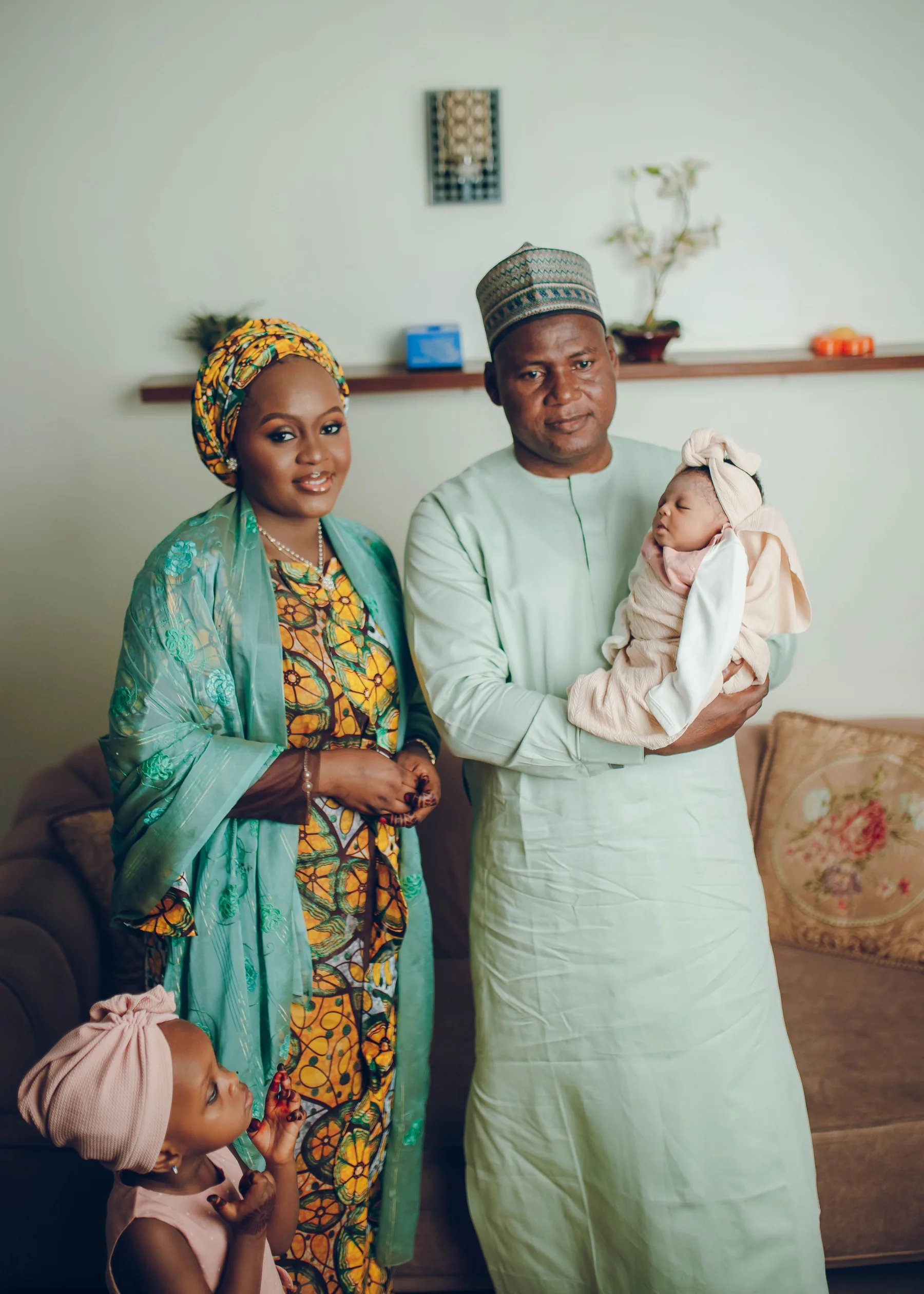A Nigerian family in a warm home setting, representing comfortable home ownership through Syrol Homes