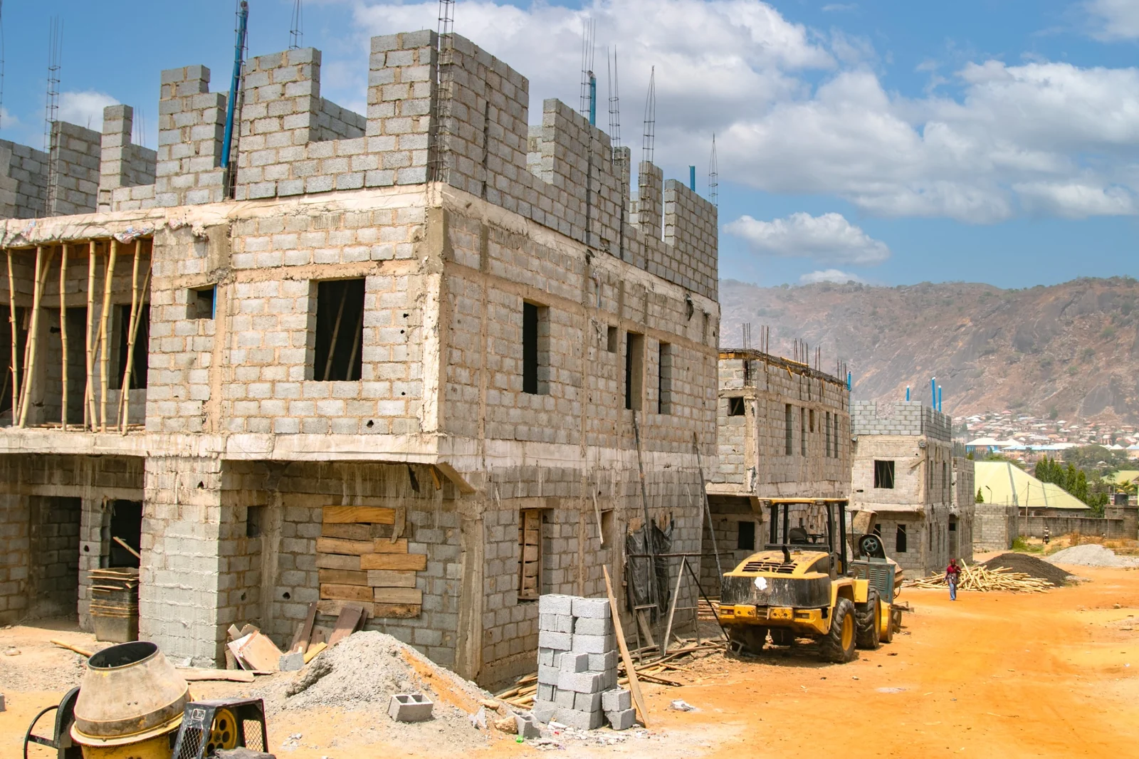 Residential construction progress with blockwork and scaffolding