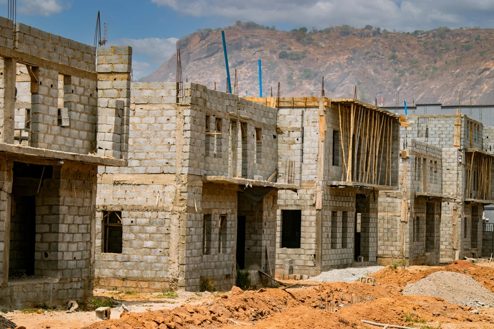 Ongoing residential blockwork with construction equipment on site